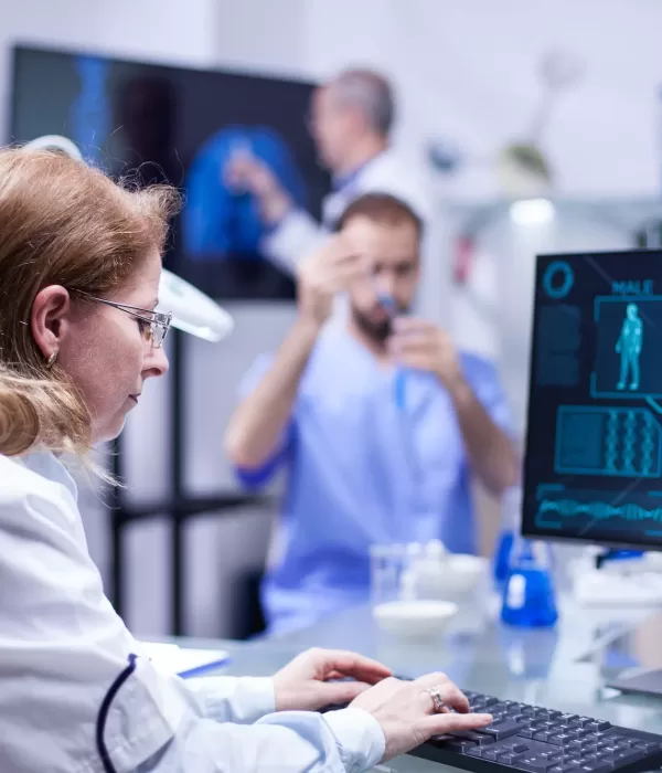 Woman working with computer in the office of a science laboratory